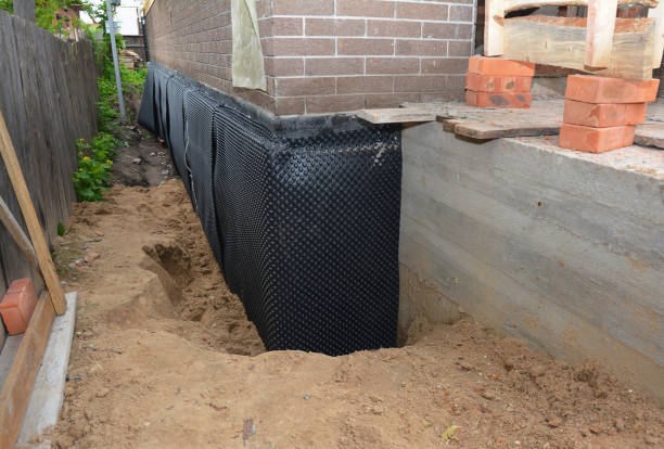 Happy homeowners after waterproofing job in Larsen